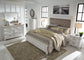 Kanwyn Queen Panel Bed with Mirrored Dresser and 2 Nightstands